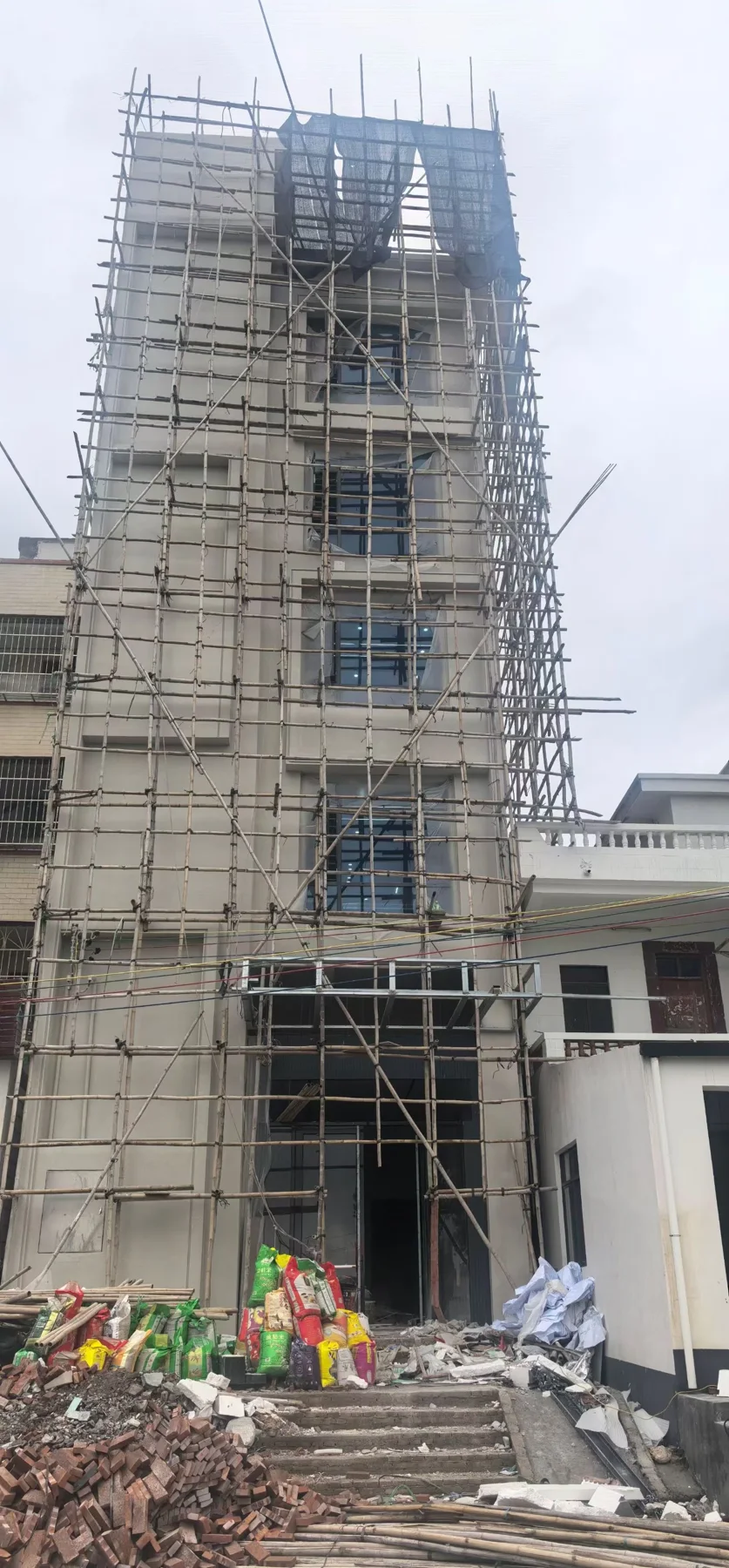 Residential window installation with scaffolding